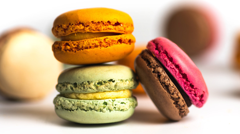 Macaroon colorful desserts on white background isolated Macaron dessert or French macaroon a sweet meringue based confection made with egg white, icing sugar, granulated sugar, almond paste and food coloring